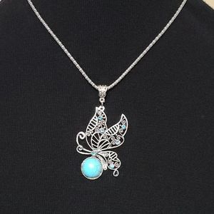 Butterfly pendant necklace.  Topaz colored stone w